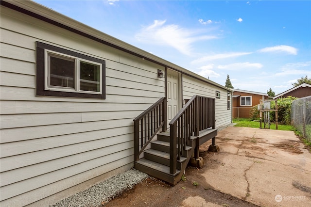 view of property exterior with a patio