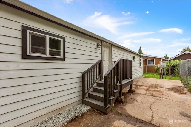 doorway to property with fence