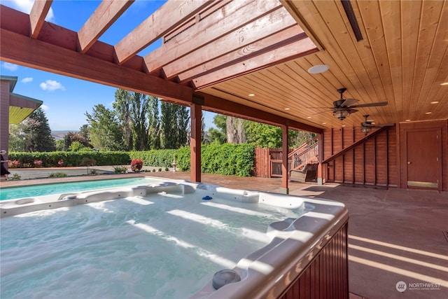 view of pool with a pergola, ceiling fan, and a hot tub