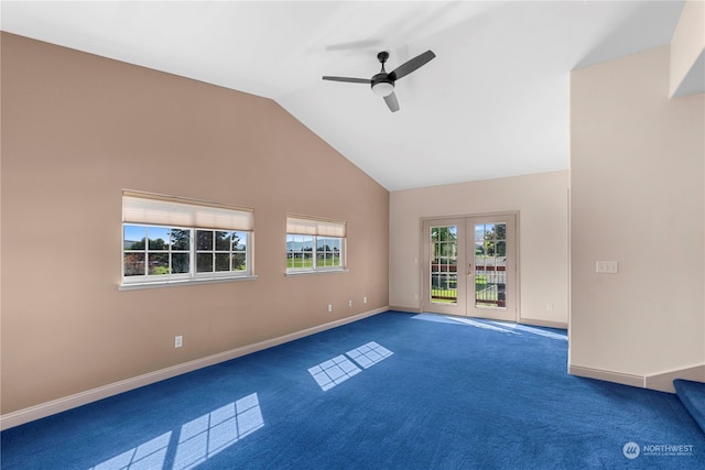 unfurnished living room with high vaulted ceiling, ceiling fan, carpet, and french doors