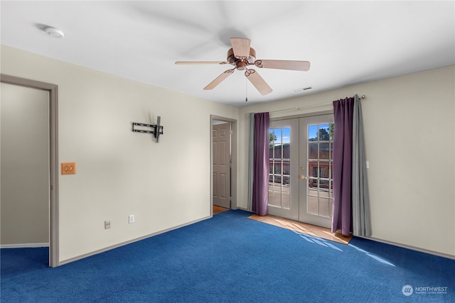 unfurnished room with ceiling fan, carpet, and french doors