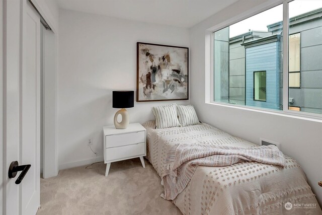 bedroom featuring light carpet, baseboards, and visible vents