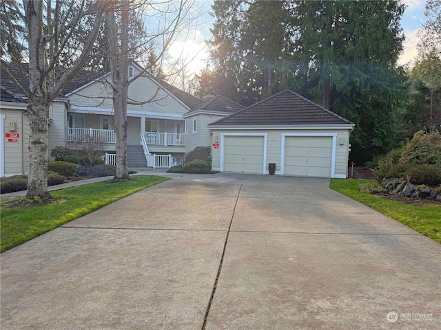 view of front facade with covered porch and a garage