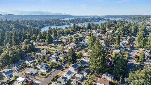 drone / aerial view with a water and mountain view