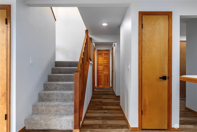 staircase featuring hardwood / wood-style floors