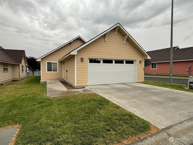 view of front of property with concrete driveway, an attached garage, and a front lawn