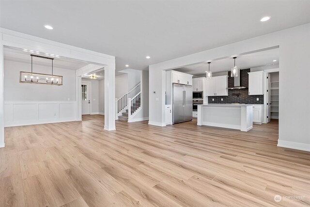 unfurnished living room featuring light wood-type flooring