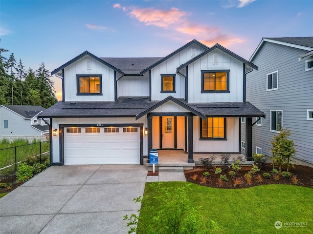 modern farmhouse with a garage and a yard