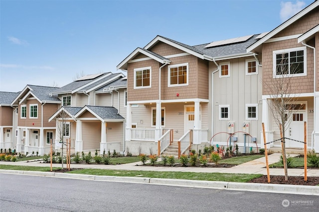 view of front of property with solar panels