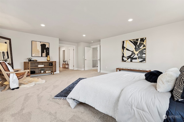 bedroom featuring light carpet