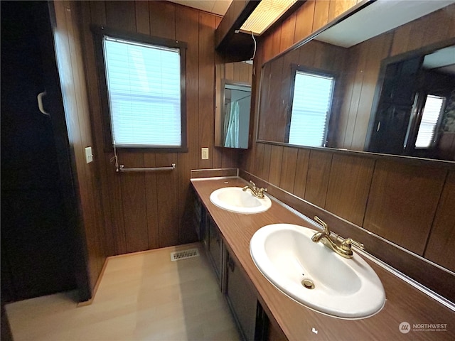 1411 300th Pl, Ocean Park, WA 98640 - bathroom featuring wood walls and vanity