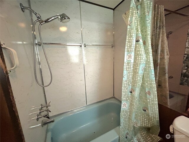 1411 300th Pl, Ocean Park, WA 98640 - bathroom featuring toilet and shower / bathtub combination with curtain