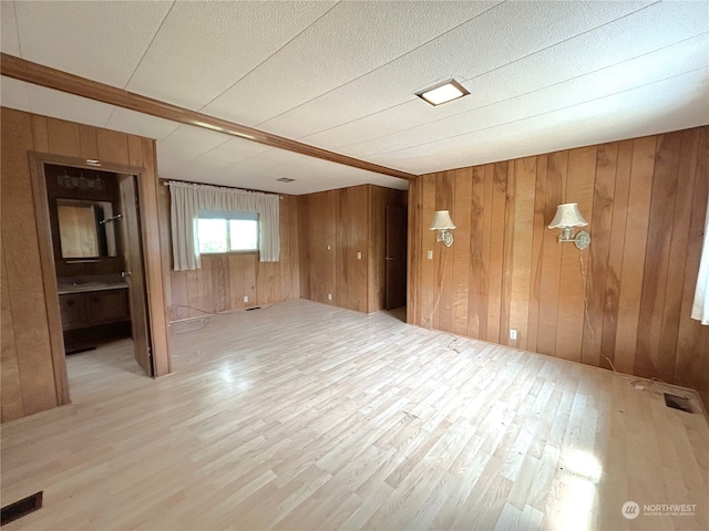 1411 300th Pl, Ocean Park, WA 98640 - unfurnished room with light hardwood / wood-style floors and wooden walls