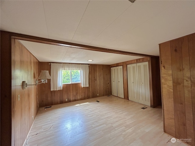 1411 300th Pl, Ocean Park, WA 98640 - spare room with wood walls and light hardwood / wood-style flooring