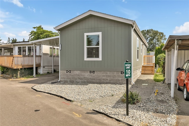 view of front of house with a wooden deck