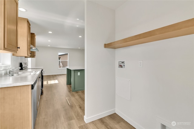 kitchen with range with electric stovetop, light hardwood / wood-style flooring, extractor fan, and sink