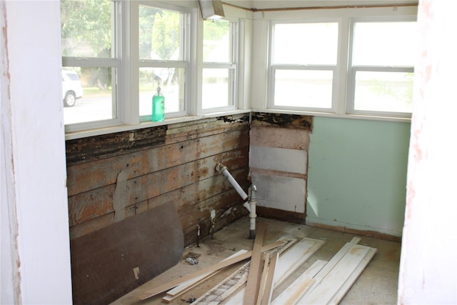 unfurnished sunroom featuring healthy amount of natural light