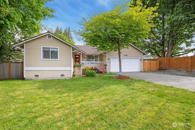 view of front of home with a garage and a front yard