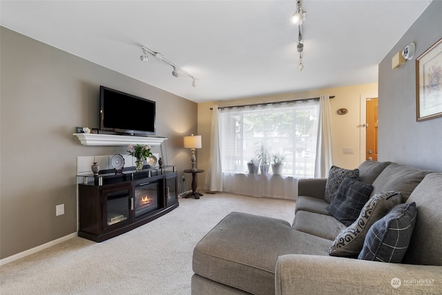 living room featuring track lighting and light colored carpet