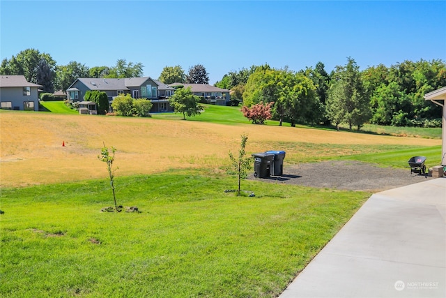 surrounding community featuring a yard