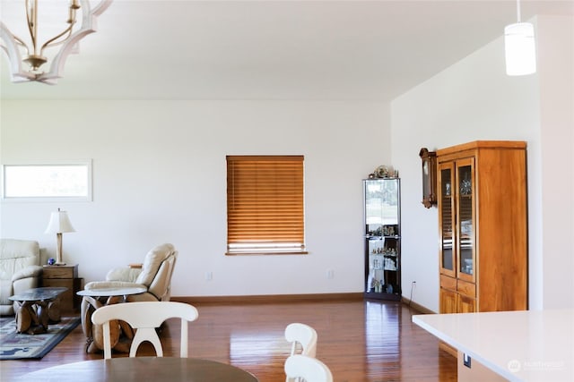 living room with baseboards and dark wood finished floors