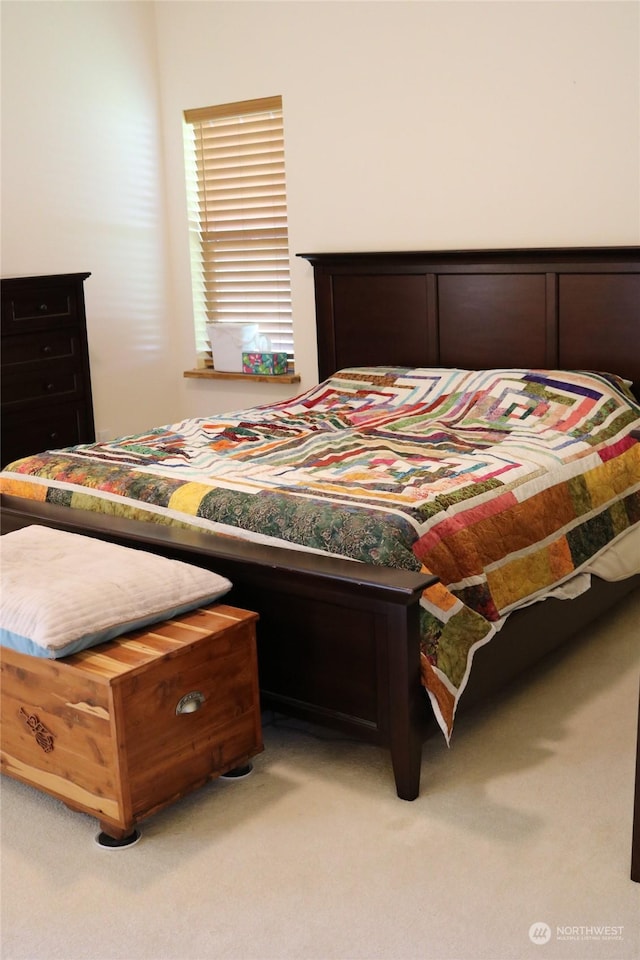 bedroom featuring light colored carpet