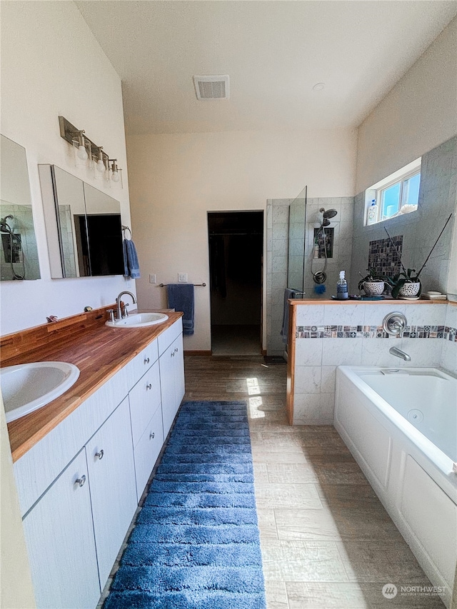 bathroom featuring vanity and a bathtub