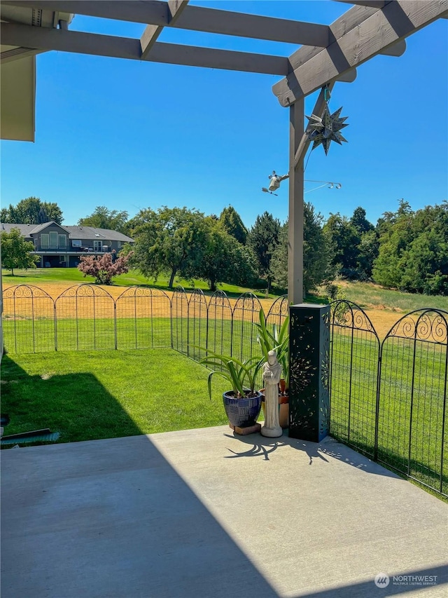 view of patio featuring fence