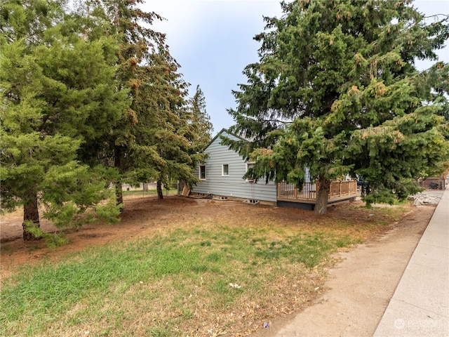 view of yard with a wooden deck