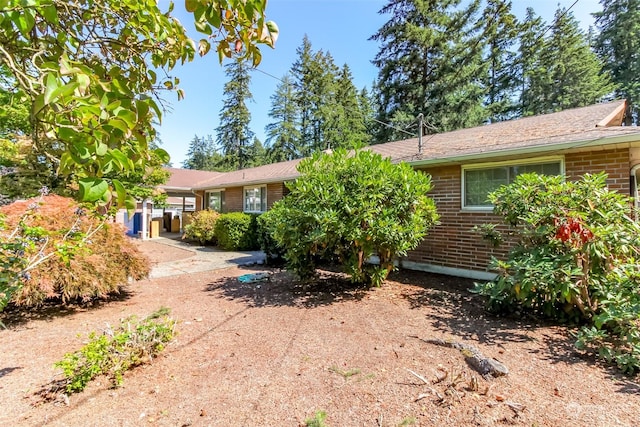 17407 36th Ave E, Tacoma, WA 98446 - rear view of house featuring brick siding