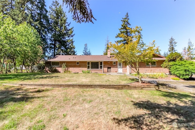 17407 36th Ave E, Tacoma, WA 98446 - ranch-style house featuring brick siding, a chimney, and a front yard