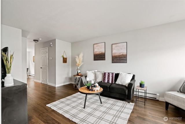 living room featuring baseboards, baseboard heating, and wood finished floors