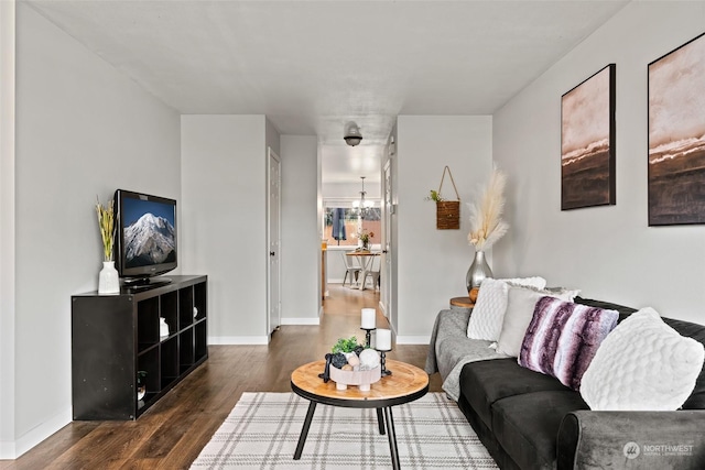 living area featuring wood finished floors and baseboards