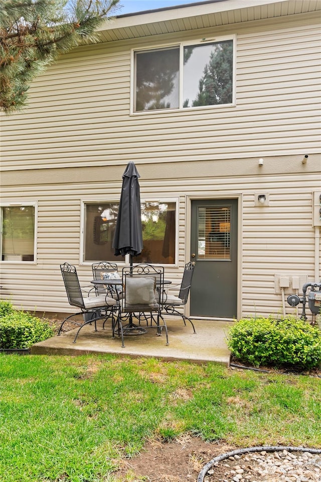 rear view of house featuring a patio