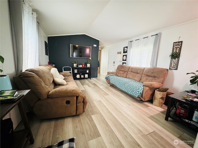 living room with light wood-type flooring, vaulted ceiling, and crown molding