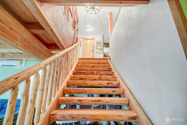 stairway featuring beamed ceiling