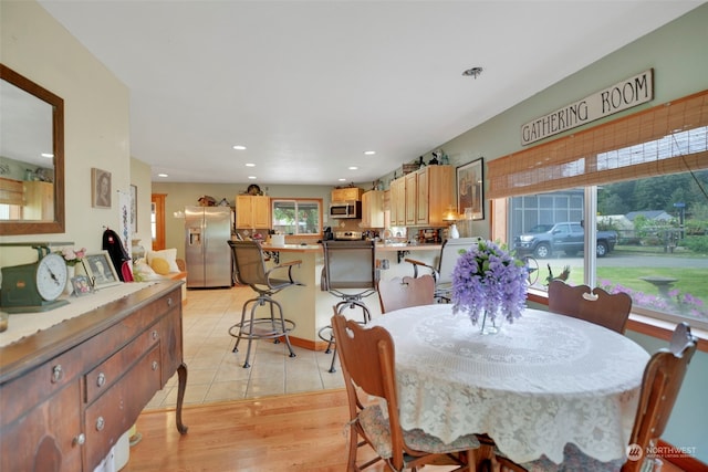 dining room featuring light tile patterned flooring and recessed lighting