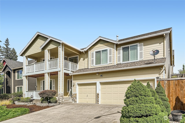 view of front facade featuring a garage and a balcony