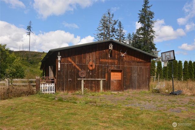 view of outdoor structure with a lawn