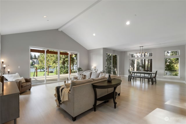 living room with a chandelier, beam ceiling, light hardwood / wood-style flooring, and high vaulted ceiling