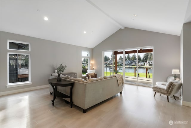 living room featuring a water view, beamed ceiling, high vaulted ceiling, and light hardwood / wood-style flooring