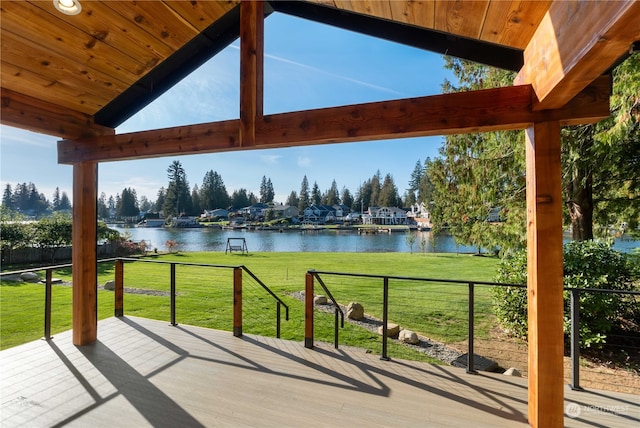 view of patio with a deck with water view