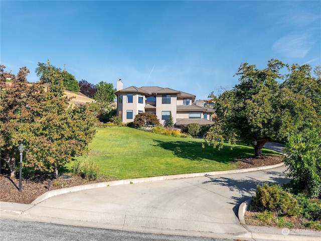 view of front of home with a front lawn