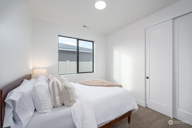 carpeted bedroom featuring a closet