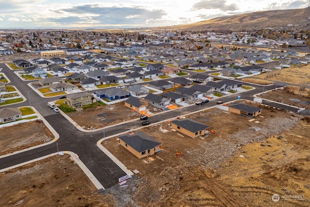 birds eye view of property with a mountain view