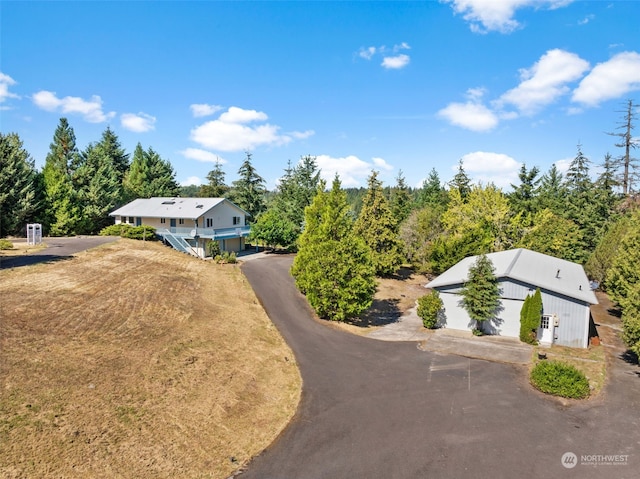 view of front of home featuring an outdoor structure and a garage