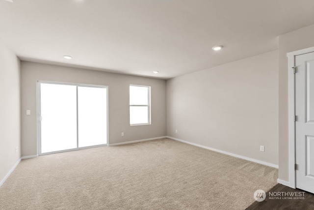 unfurnished room with carpet flooring