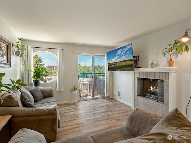 living room featuring a fireplace and hardwood / wood-style floors