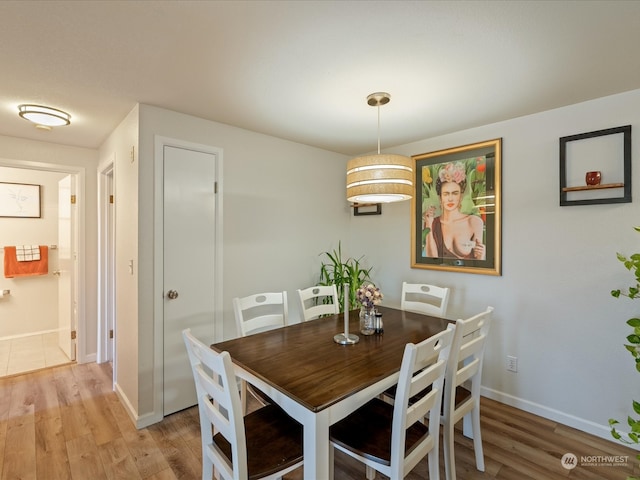 dining area with light hardwood / wood-style flooring