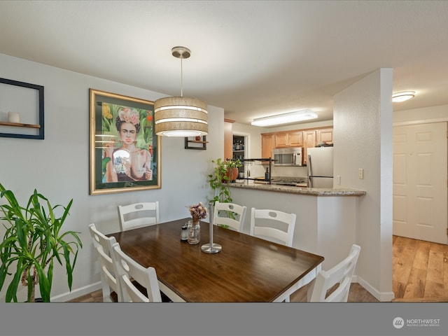 dining area featuring light hardwood / wood-style flooring